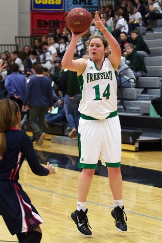 Piper shoots a field goal above a defender during a home game. Piper practiced basketball daily. "I have to do something everyday or else you won’t get better," Piper said.