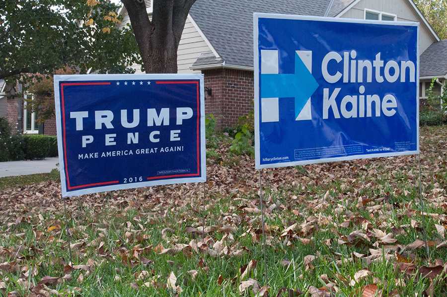 Political signs are prominently displayed in local neighborhoods for community members to show their support for their candidate of choice. This was a particularly divisive election with Clinton winning the popular vote but Trump winning the presidency.
