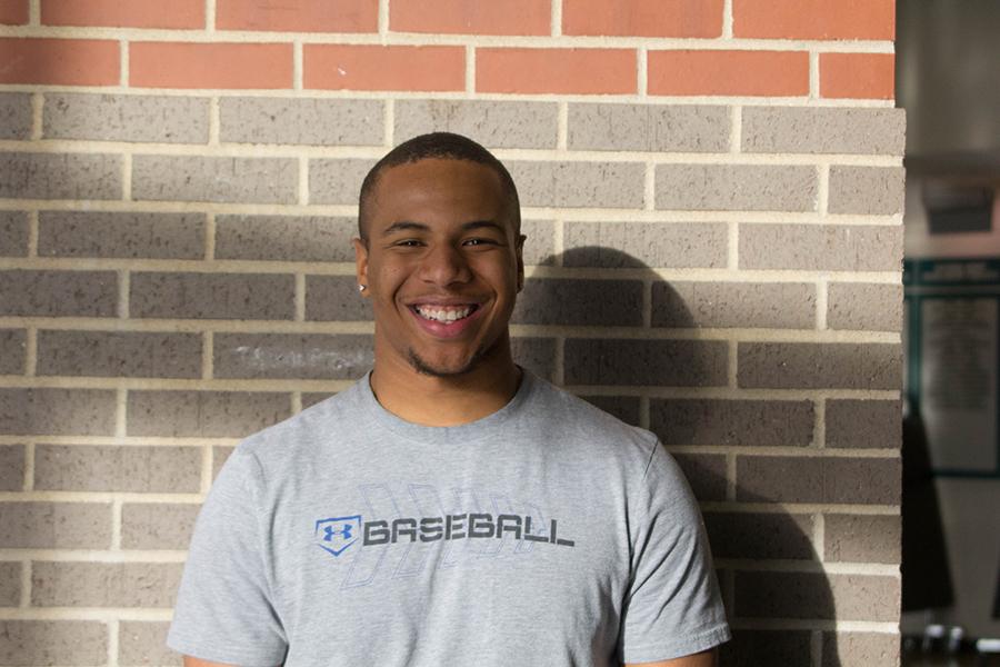 Happy from the recent news, Bowlin smiles in the commons. Bowlin has played Baseball since his freshman year.