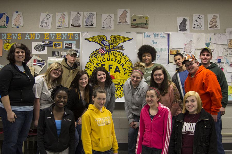 ffa members alongside advisor, laura priest