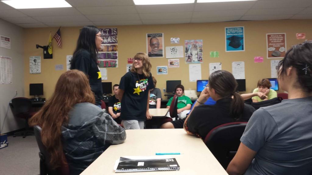 President Sophie Divney (11) runs an idea by Vice President Celine Nguyen (11) before presenting it to the club.