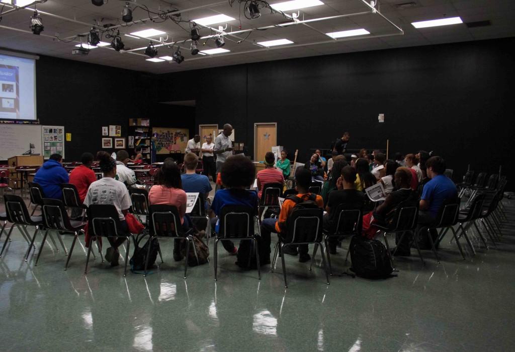 Security guard Charles Thomas leads group discussion. 