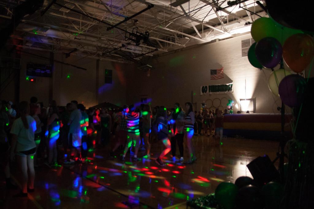 A cluster of students blur into a mass of excitement and fun during the Homecoming dance.