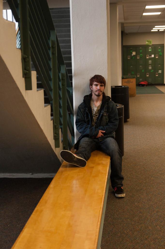 Junior Austin Welborn sits in the back hallway.