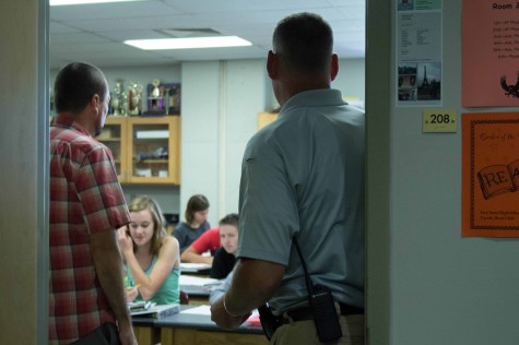 SRO Ty Scheibler goes into a science classroom to observe.
