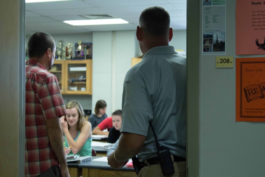 SRO Ty Scheibler goes into a science classroom to observe. 