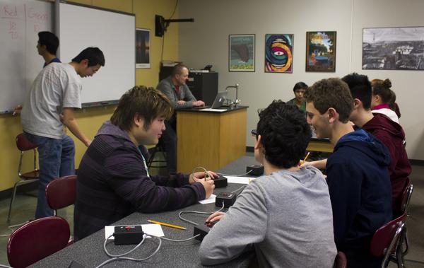 Discussing amongst one another during a game of trivia, members of Scholars Bowl practice for upcoming tournaments. So far Free State has produced a successful season. This is my eighteenth year coaching Scholars Bowl here at Free State and Ive been the only coach that weve had here, Strawderman said.