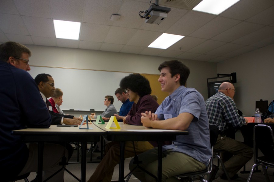 Junior Donovan Young and sophomore Arlo March, students selected to be in the Ambassador Program, get to know their business partners before the start of the programss second meeting. The students were selected based on counselor recommendations. 