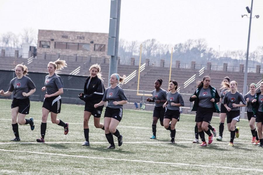 Leading warm-ups (from left), junior Mika Schrader, senior Hannah Reussner, junior Allie Knapp, senior Lindsey Wethington, sophomore Goosie Zicker, juniors Marcela Ellabracht and Sidney Zavala run laps around the football field during practice.