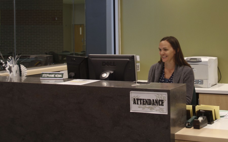 Attendance Secretary Stephanie Kema at her desk. 