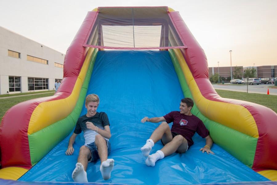 Swedish exchange students,Kevin Munge (right) and Simon Larspers (left), finish the obstacle course at Free States club fair.