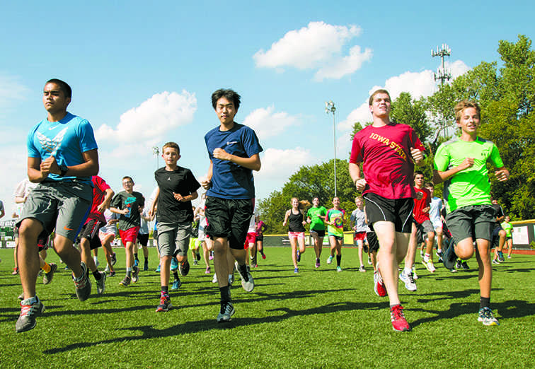 Senior Chris Blevins, freshman Trey Melvin, junior Sid Lin and senior Bret Carey run during an after school cross country practice. they are team members o the largest cross country team in school history. The number of team members has been steadily increasing for past years.