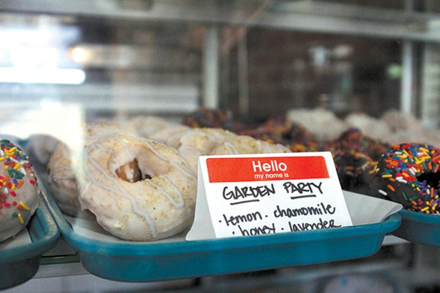 Lavender,chamomile,honey and lemon create the popular "Garden Party" doughnut, sold at Ladybird Diner in Downtown Lawrence. A new kitchen was made downstairs, where the staff creates the different flavored doughnuts to be put out each day.