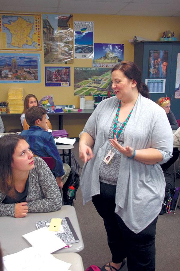 During fourth hour, Williams explains a concept to Spanish 3 student, sophomore Kaya Shafter. Williams has created a new homework system for her classes, focusing on student activities rather than bookwork. 