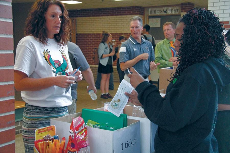 During Friday lunch periods, math teacher Samantha Newlin gives out prizes to students in exchange for their Talon Tickets. Students have the opportunity to earn school supplies or Firebird t-shirts depending on the amount of tickets they turn in. 