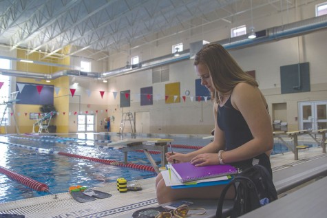 At the pool, senior Cierra Campbell focuses on finishing her daily school work.