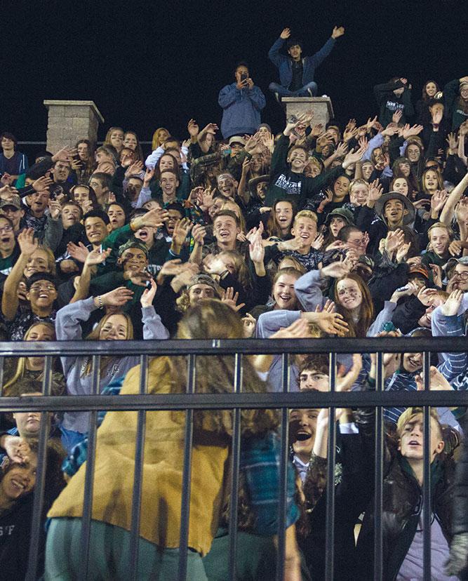 As junior Kahler Wiebe leads the the crowd in “the roller coaster,” she gets them hyped up during the Homecoming game. Earlier this year, Wiebe reinstated Hype Club to get more students involved in school spirit. “It’s still 

starting out but with the help of Hype Club it will help build up 

the school spirit more,” Wiebe said.