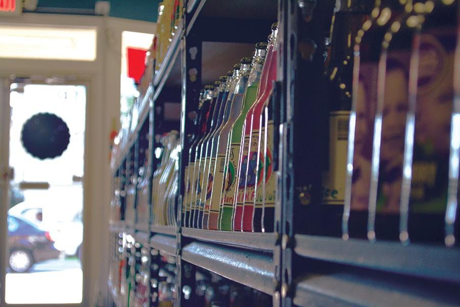 Bottles of soda are highlighted by the afternoon sun at Mass Street Soda on 1330 Mass Street. 1,300 varieties of craft soda are displayed on their shelves.