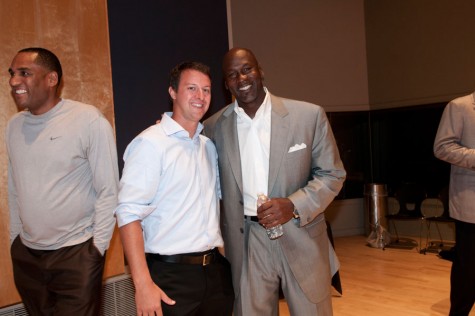 Stroh poses for a photo with Michael Jordan. Stroh had dinner with Jordan and Obama after winning a contest. 