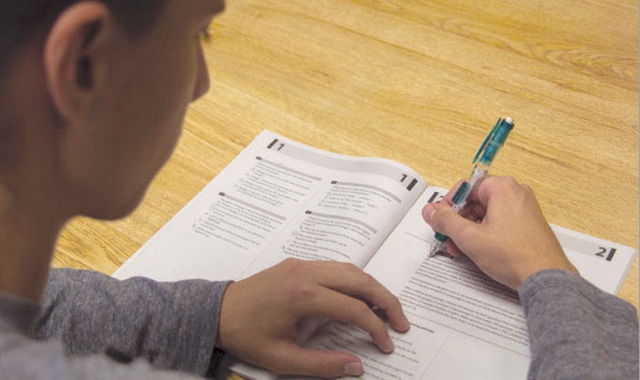 Working on a practice SAT packet, junior Santiago Trejo prepares for the real test. 