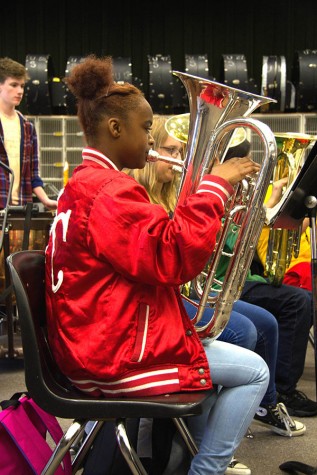 Playing the euphonium, Britney Linnear focuses on her next tune. Over the course of the year, students learn various songs and jingles to play for their upcoming concerts.