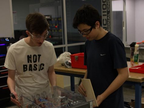 Tyson Dent and Sean Riling work on their robot at the College and Career Center. The Robotics Team has access to the College and Career Centers new facilities that include 3D-printers.