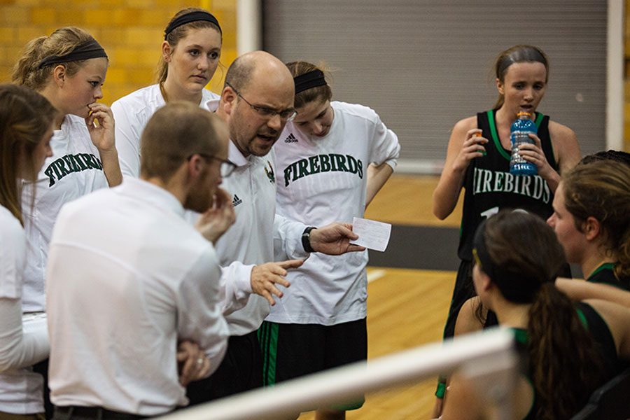 Coach Duncan calls a timeout during an away game. This is Duncans last year of coaching for the girls basketball team.