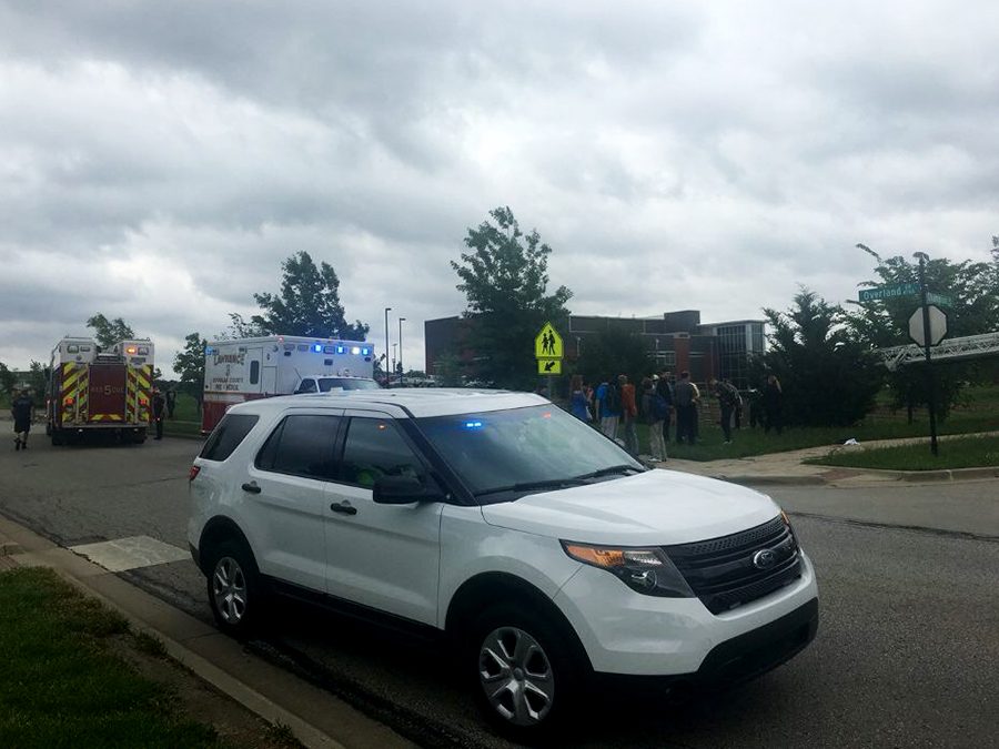 A Lawrence Police Department vehicle parked near the scene of the incident. Students were alarmed by the sudden presence of emergency services during their lunch period.