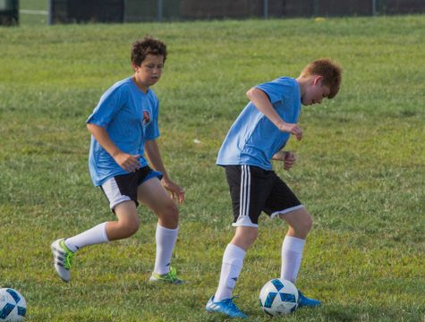 Sophomore William Davis practices with sophomore Conner Jones. D team players had a chance to step up to higher teams if they showed improvement. 