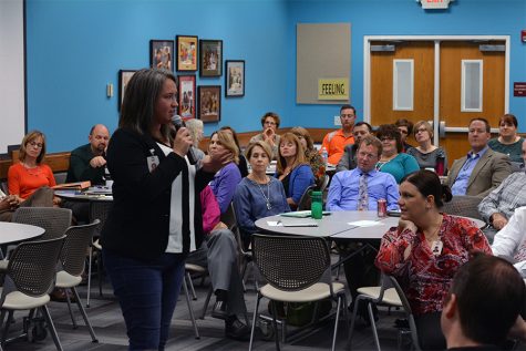 Lawrence High SPED chair Lindsay Buck introduces the panel members. Lindsay Buck was asked to organize the panel by superintendents at the district office.