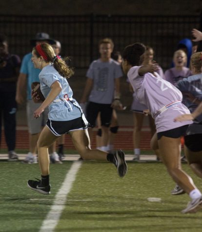 Sophomore Morgan Dunn pursues Junior Erin Cushing. The players were organized by grade into teams.