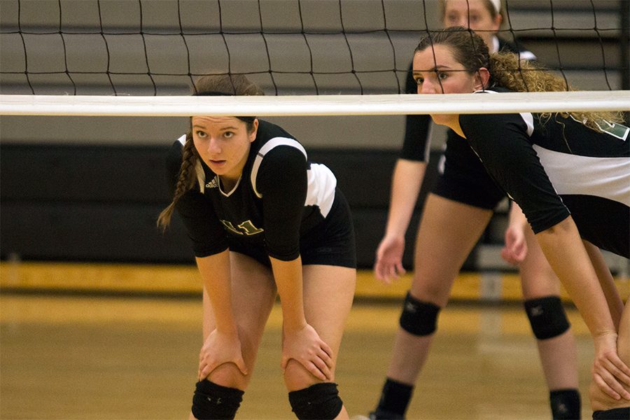 Seniors Jenalee Dickson and Naomi Hickman rest between a set. During the post-season, the Firebirds toppled undefeated and no. 5 national seed Blue Valley West