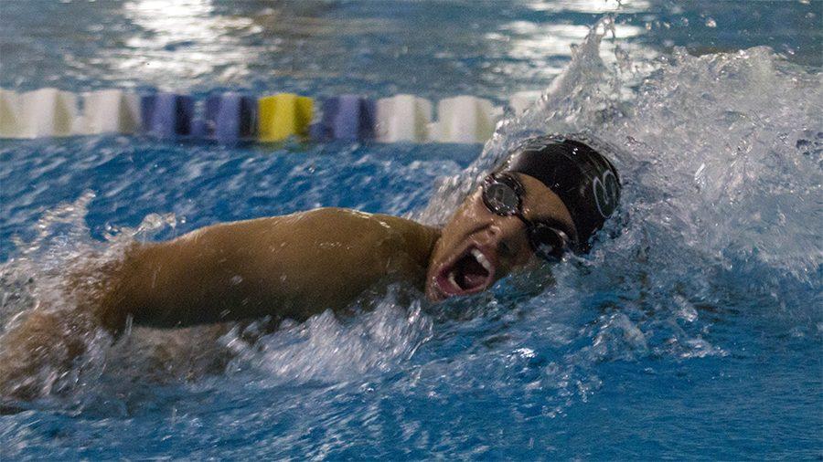 Eugene Galvez swims in a freestyle event. The current school record for the 50 meter freestyle is held by Jack Ziegler at 20.90 seconds.