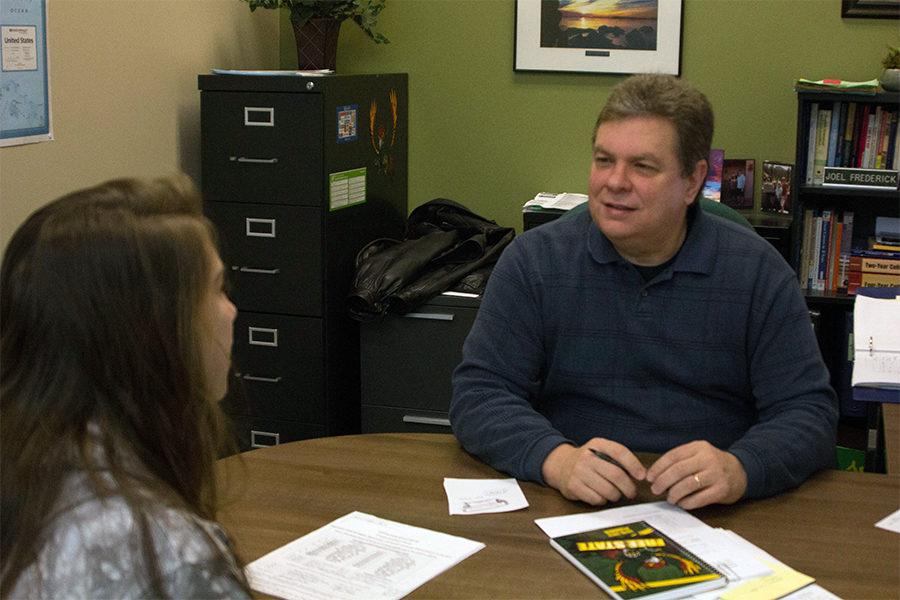 Junior Maddison Smith and counselor Joel Frederick discuss a schedule for senior year. Currently, only seniors are eligible for reduced schedule.