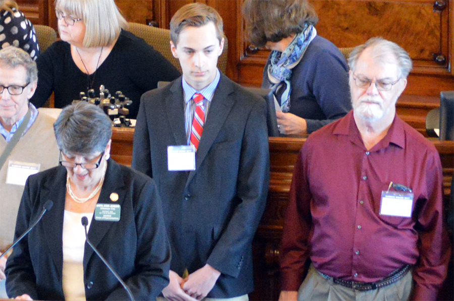 Junior Adam Ziegler and anthropologist Donald Blakeslee are recognized in front of the Kansas House of Representatives. The site near Arkansas City was recently recognized by the state. 