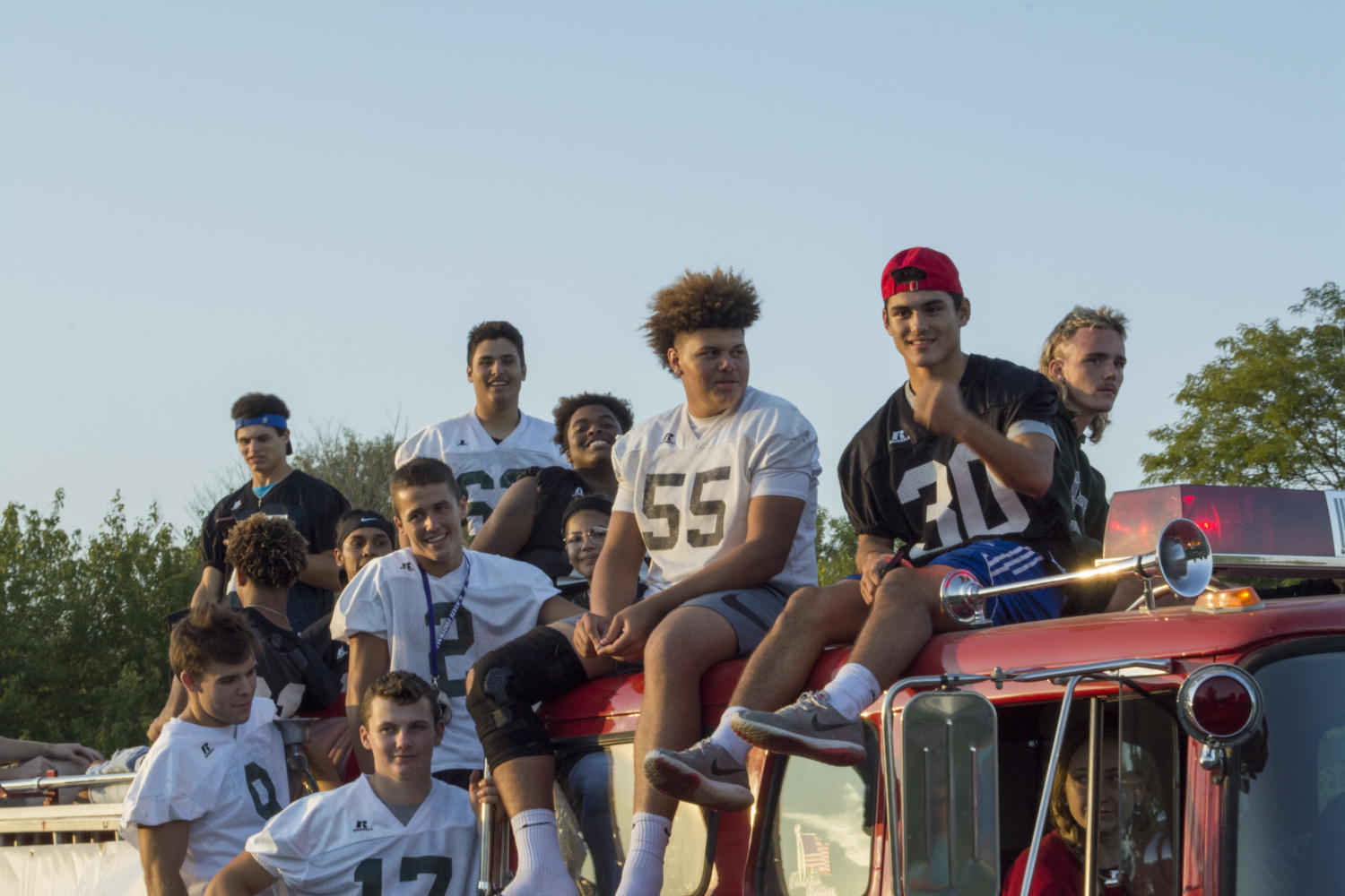 Senior football players Gage Foster, Gabe Del Valle, Gabe Clark, Jalan Robinson, Taylor Royal, Caden Johnson, Tanner Cobb, Jake Rittman, and Bo Miller ride the senior football float. The float was a decommissioned firetruck with a working horn and siren. 