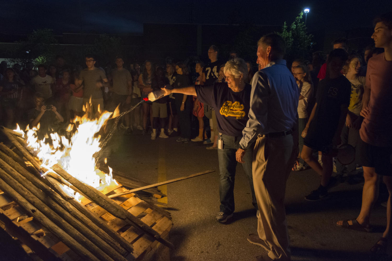 Librarian Leslie Campbell and principal Myron Graber attempt the light the bonfire. The fire wouldnt stay lit Monday night.