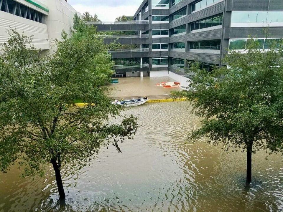 Storm surges seep into an office complex in Houston. Over 6 days, the storm dumped 27 trillion gallons of rain over Texas and Louisiana.