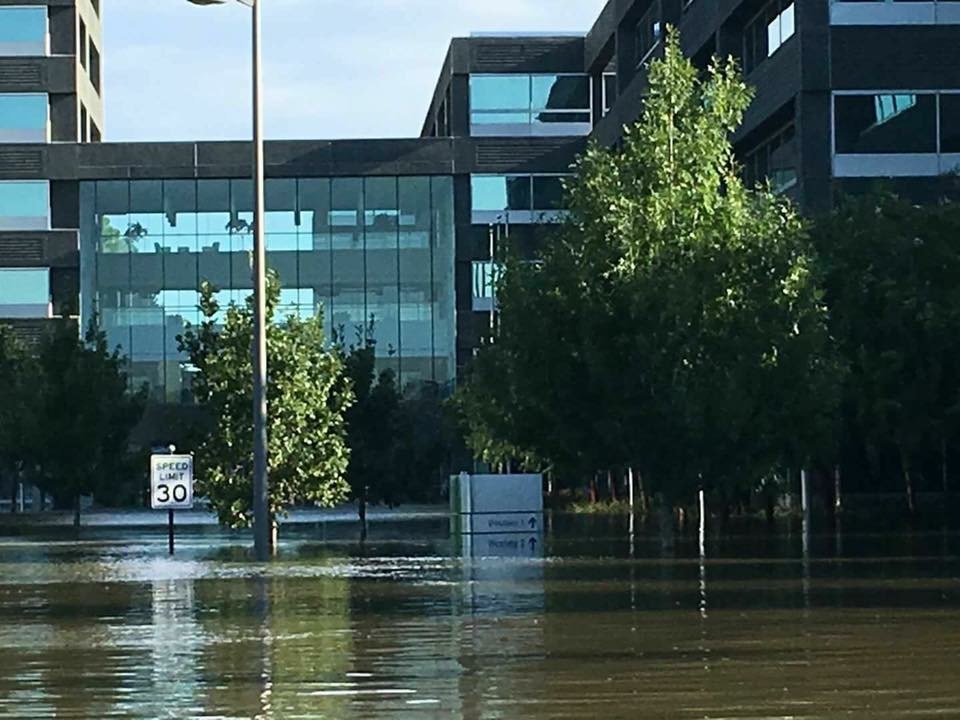 Floodwaters nearly submerged street signs in downtown Houston. Damages reached $75 billion from the storm.