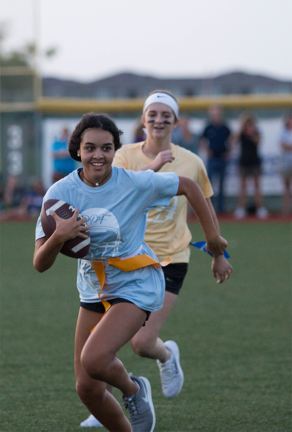 Senior Samantha Powell chases down sophomore Mackenzie Thomas near the endzone. The seniors won in the tiebreaker.