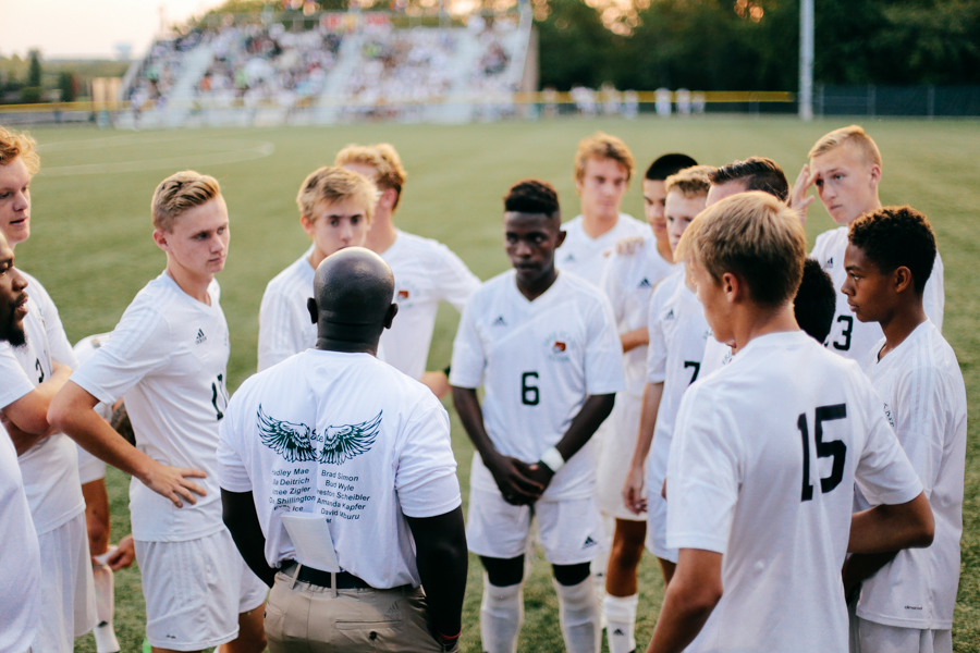 Coach Kelly Barah speaks with the team before the game begins. The Firebirds won 5-4 in overtime.