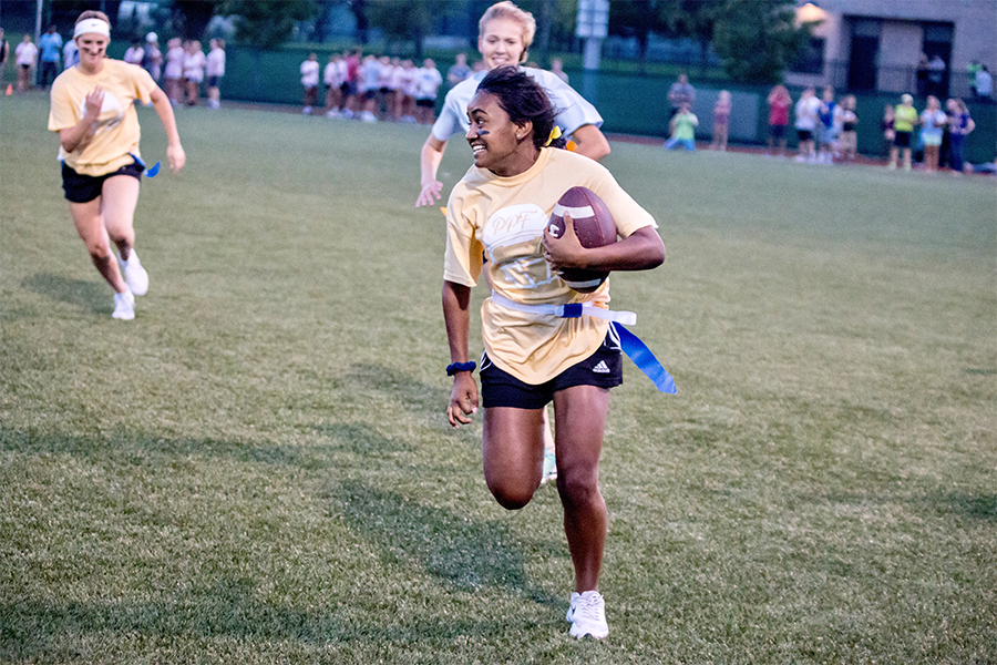 In the process of completing her forth touchdown of the night, Hodison takes the ball down field. Hodison scored a majority of the seniors touchdowns leading them to victory against the sophomores. 