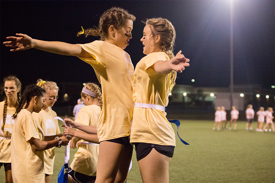 Celebrating a win against the sophomore team, seniors Maggie Ziegler and Grace Patchen chest bump. The seniors fell short one point to the juniors in the championship.