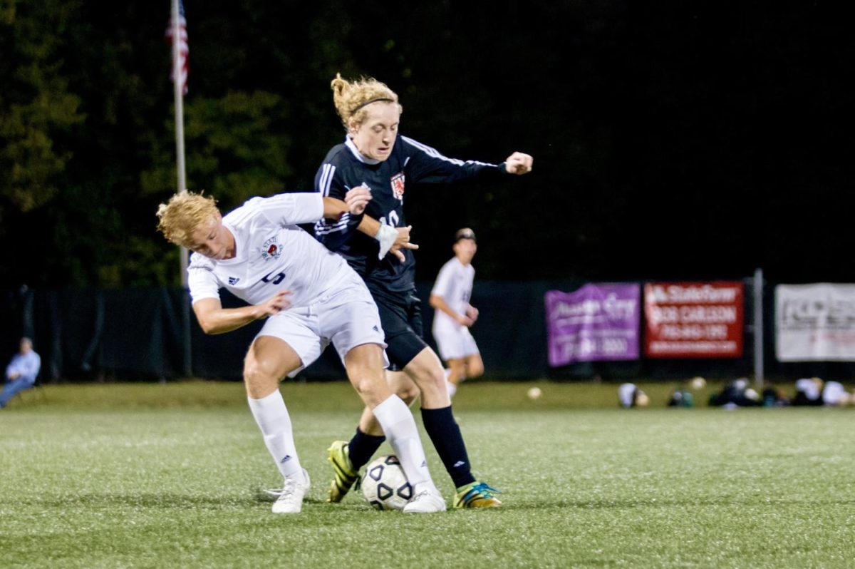 Charlie Newsome and an LHS defender battle for possession of the ball. Newsome scored 13 minutes into the first half 