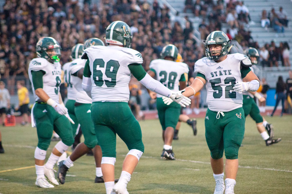 Seniors Nathan Spain and Spencer Roe High-five after Roe recovers a fumble. Near the beginning of the 3rd quarter Spain made an interception breaking SMWs play.  My hopes for this season is to make it to the state championship game Spain says. 