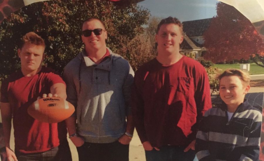 Jax, Joe, Jay and Jet Dineen pose for a family photo. Jax Dineen is a junior who plays running back for the firebirds 