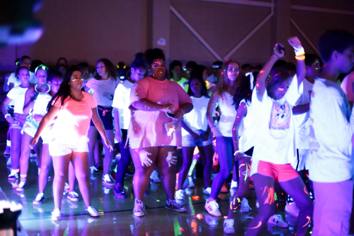 Dancing+to+the+Cha+Cha+Slide%2C+students+filled+the+gym+for+a+thrilling+bookend+to+Homecoming+week.