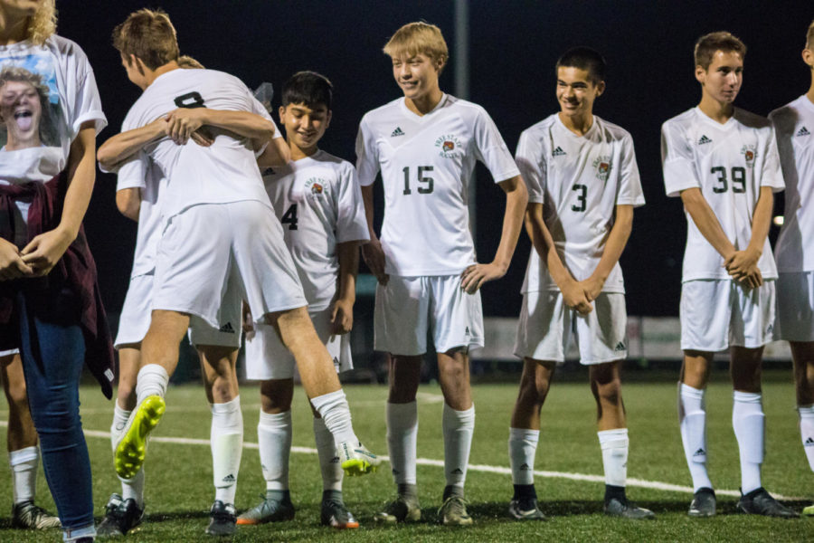 Senior Nick Howard gets recognized and hugged by every member of his team. The seniors were congratulated on all their hard work throughout the season.