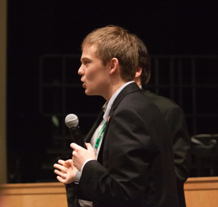 Tyler Ruzich adresses an audience member while answering a question. Ruzich describes himself as a Republican because his parents were able to go to college without government assistance.