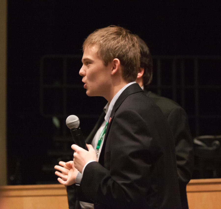 Tyler Ruzich adresses an audience member while answering a question. Ruzich describes himself as a Republican because his parents were able to go to college without government assistance. 